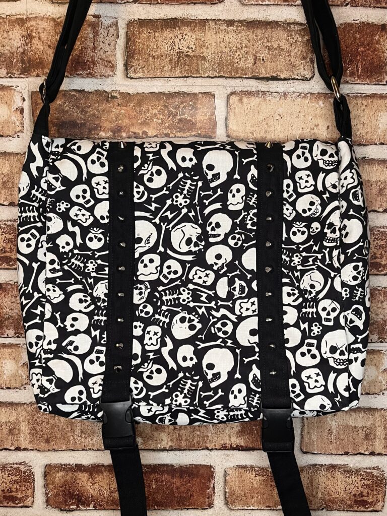 Black and white skull messenger bag